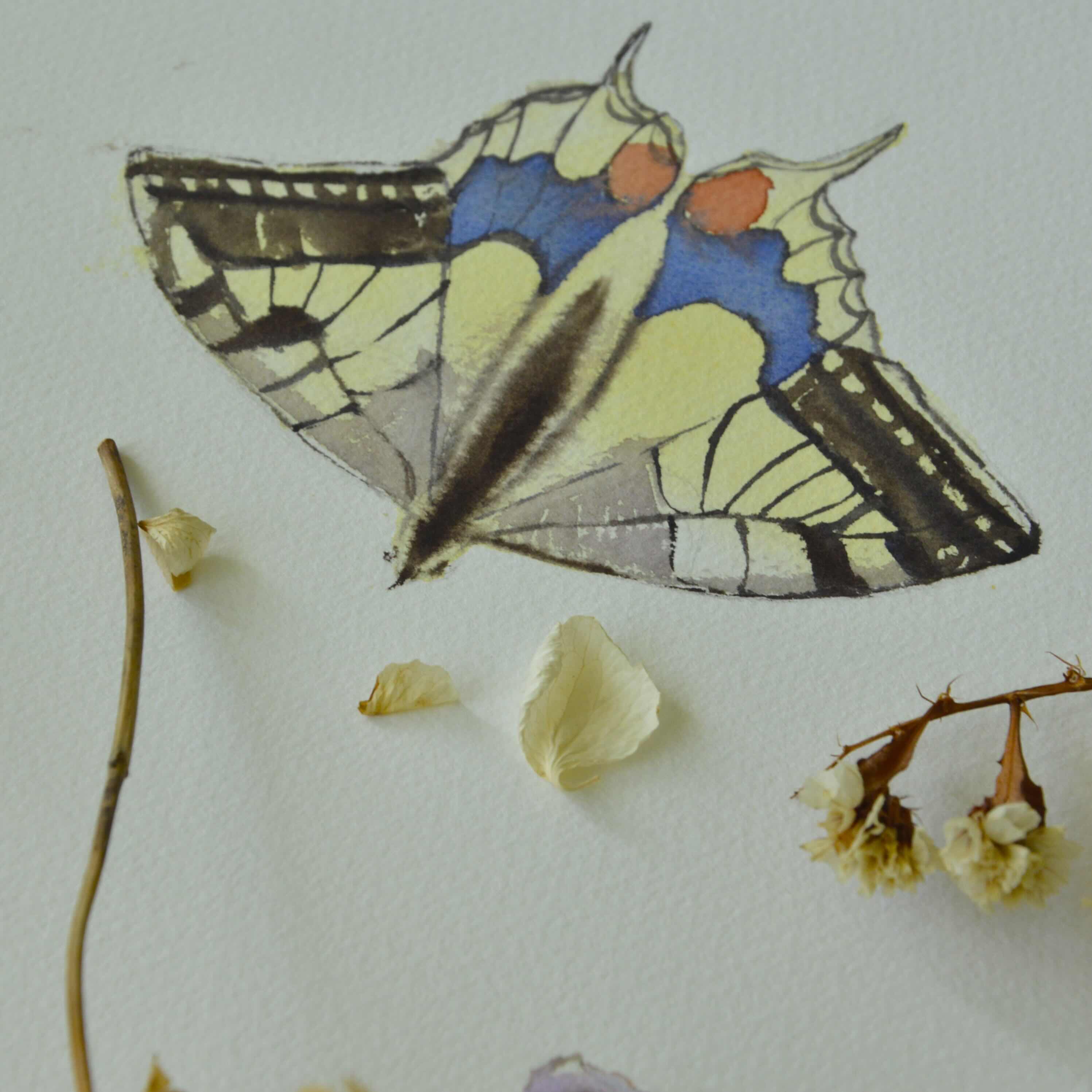 Finished watercolor painting displayed with a brush